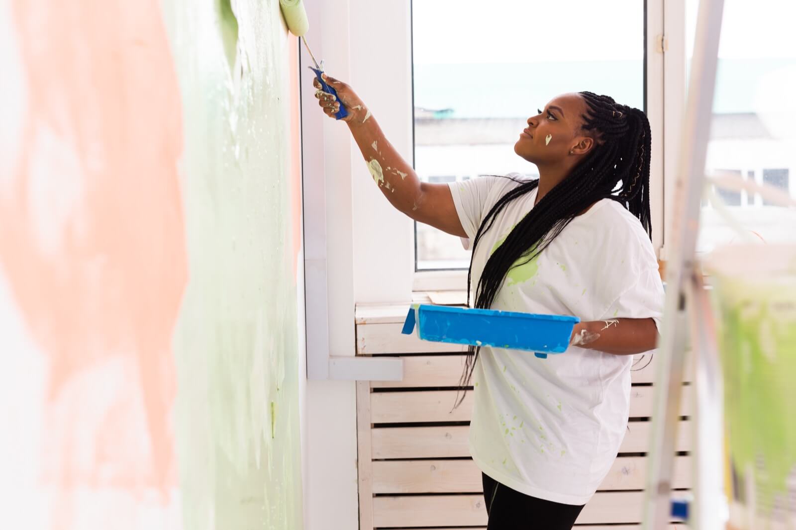 Home Staging - Woman Painting the Walls