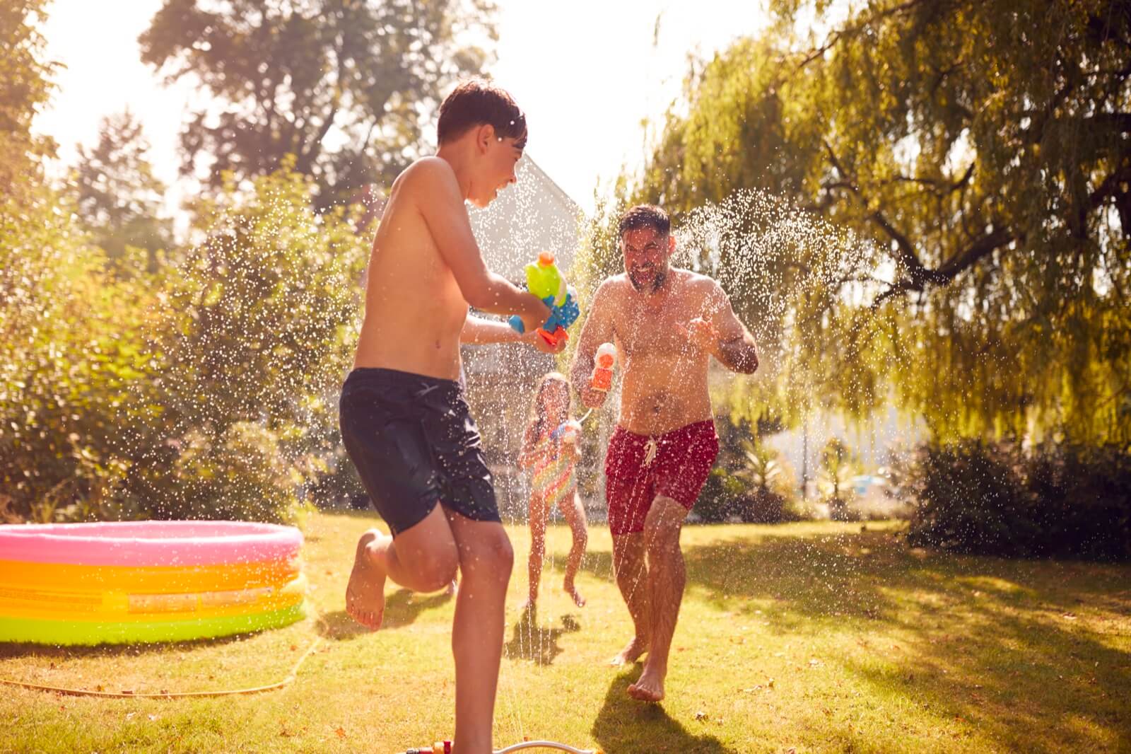 Staycation - Family Having Water Fight